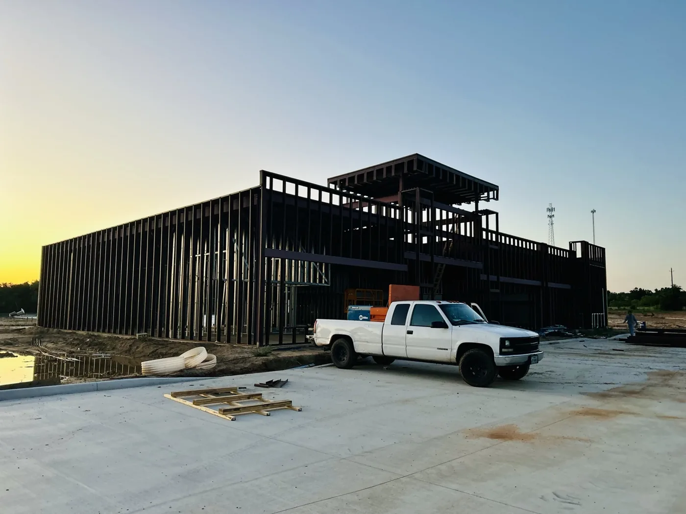 Large commercial steel building frame during construction