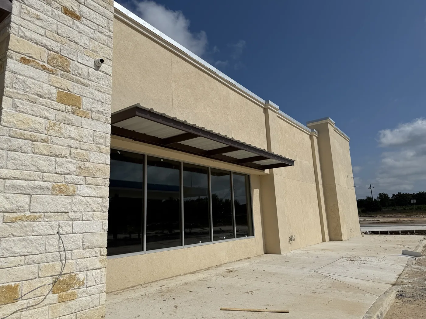 Steel commercial awning installed above a storefront entrance